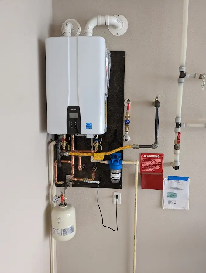 Professional plumber installing copper piping in a Shepherdsville home